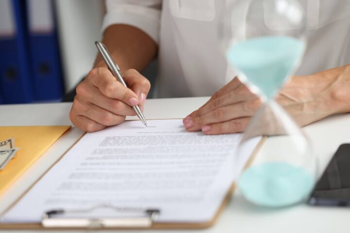 female-hand-puts-signature-contract-workplace-conclusion-employment-agreement-2048x1366